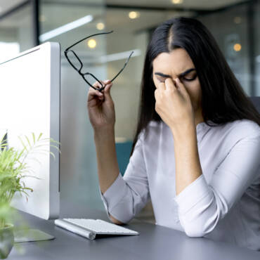 How can astigmatism be corrected with glasses?